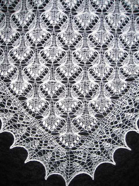 Knitted lace edging for shawl patterns